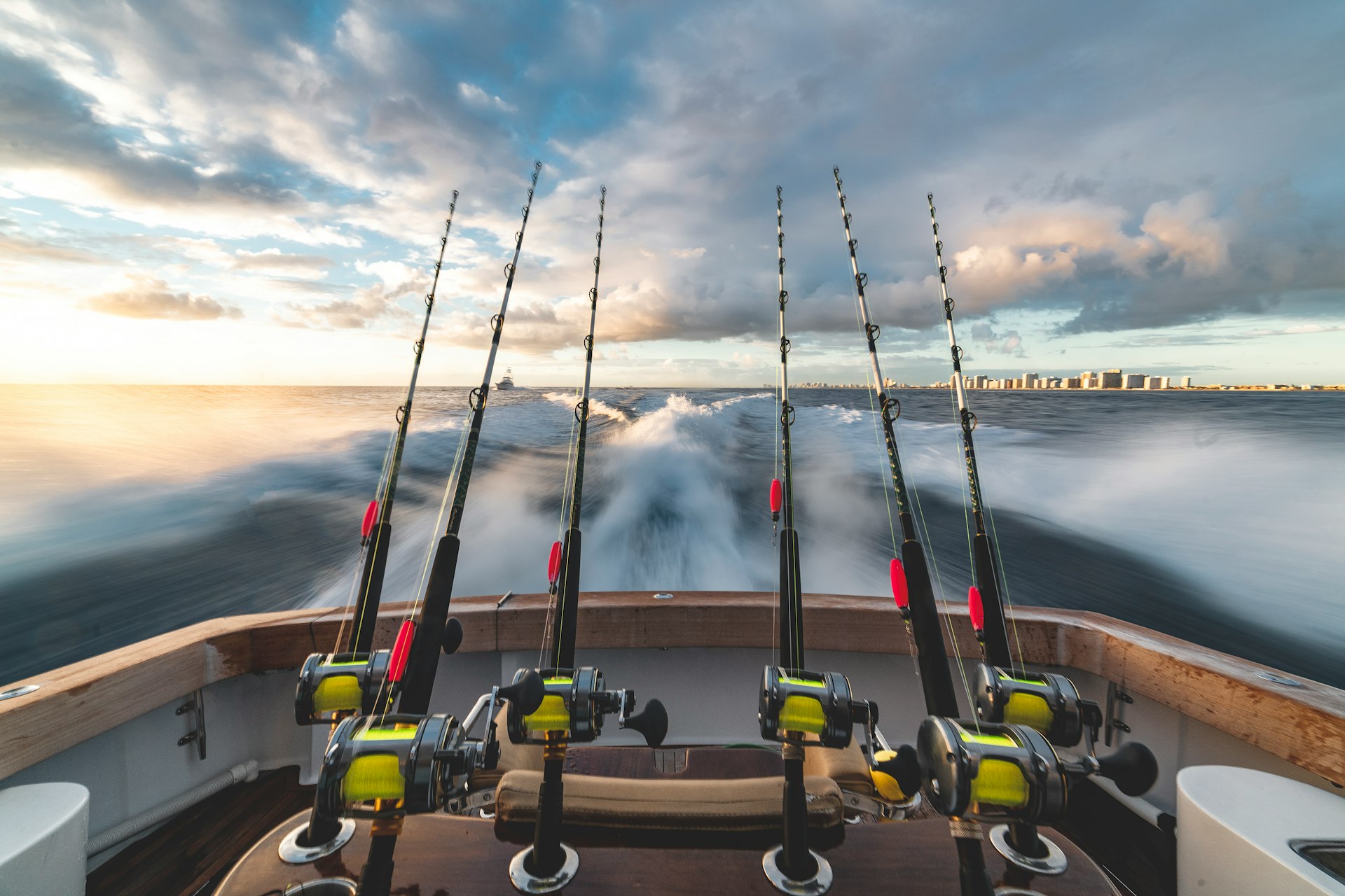 six black-and-yellow fishing rod in boat